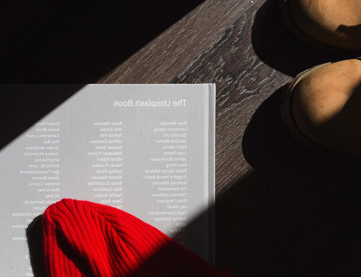 photography photo of The Unplash book on brown wooden surface table