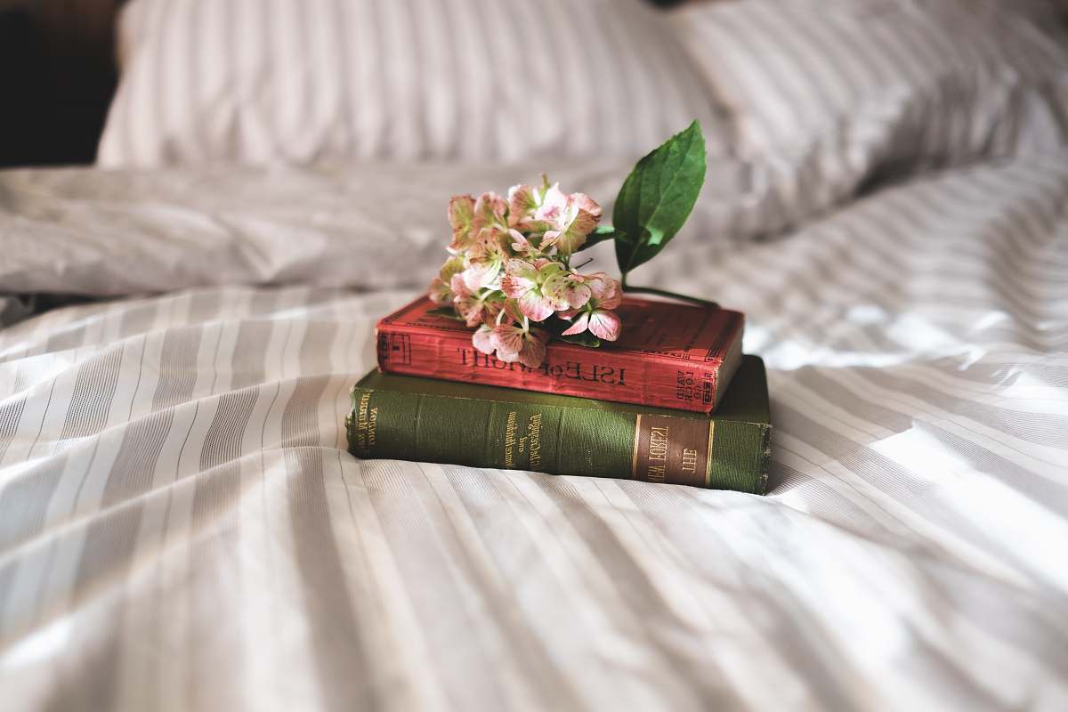flower two books on bed books