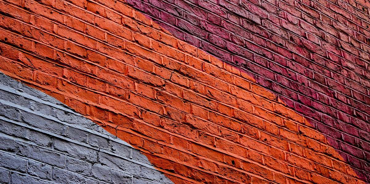 background low angle photography of concrete building with assorted-color paint wallpaper