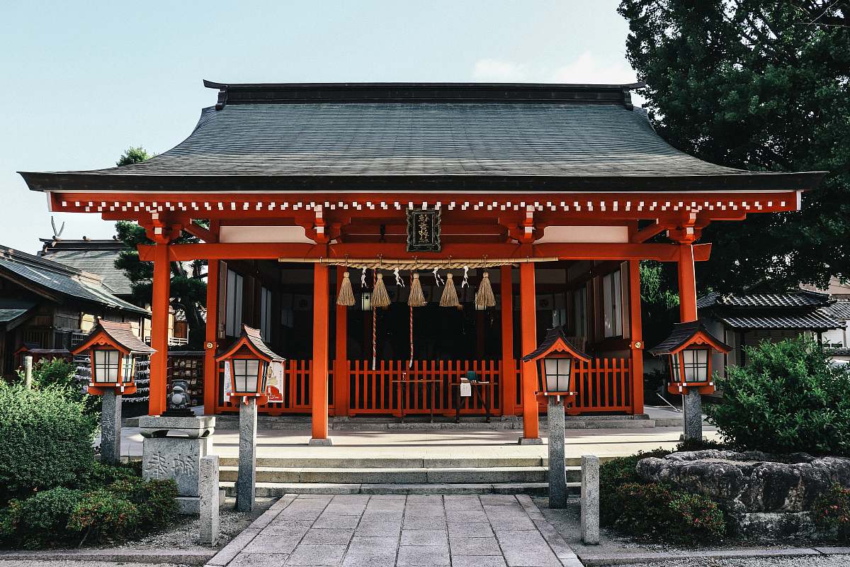temple orange and black wooden temple during day architecture