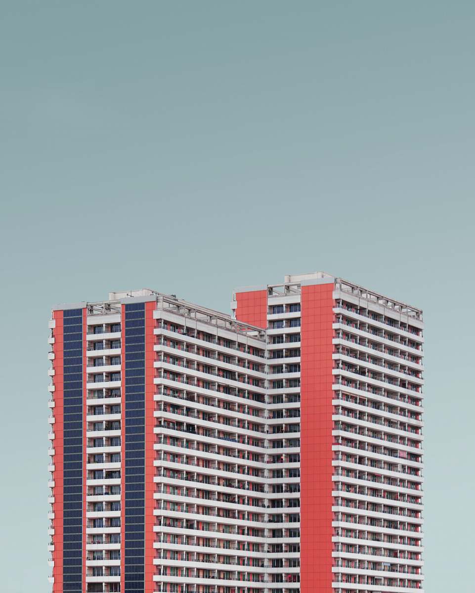 urban red and white high rise building under blue sky city