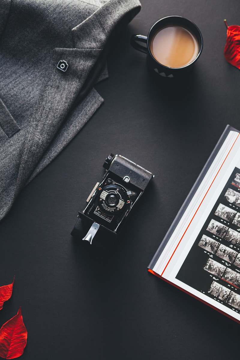 flaylay black film camera near gray suit jacket vintage