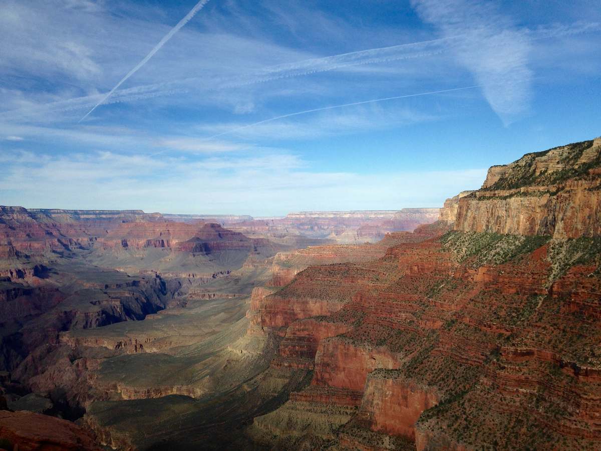 mountain mountains under blue cloudy skies valley