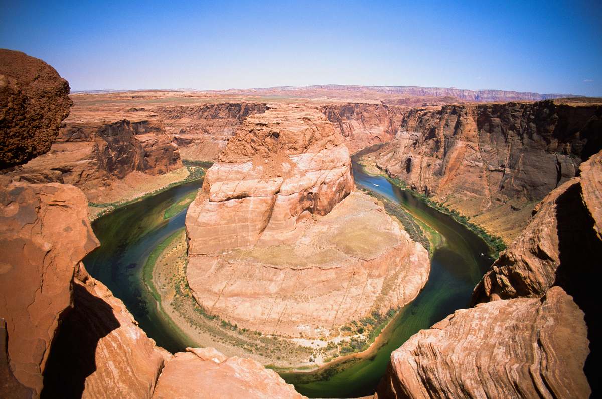 nature rock formation surrounded of body of water mountain
