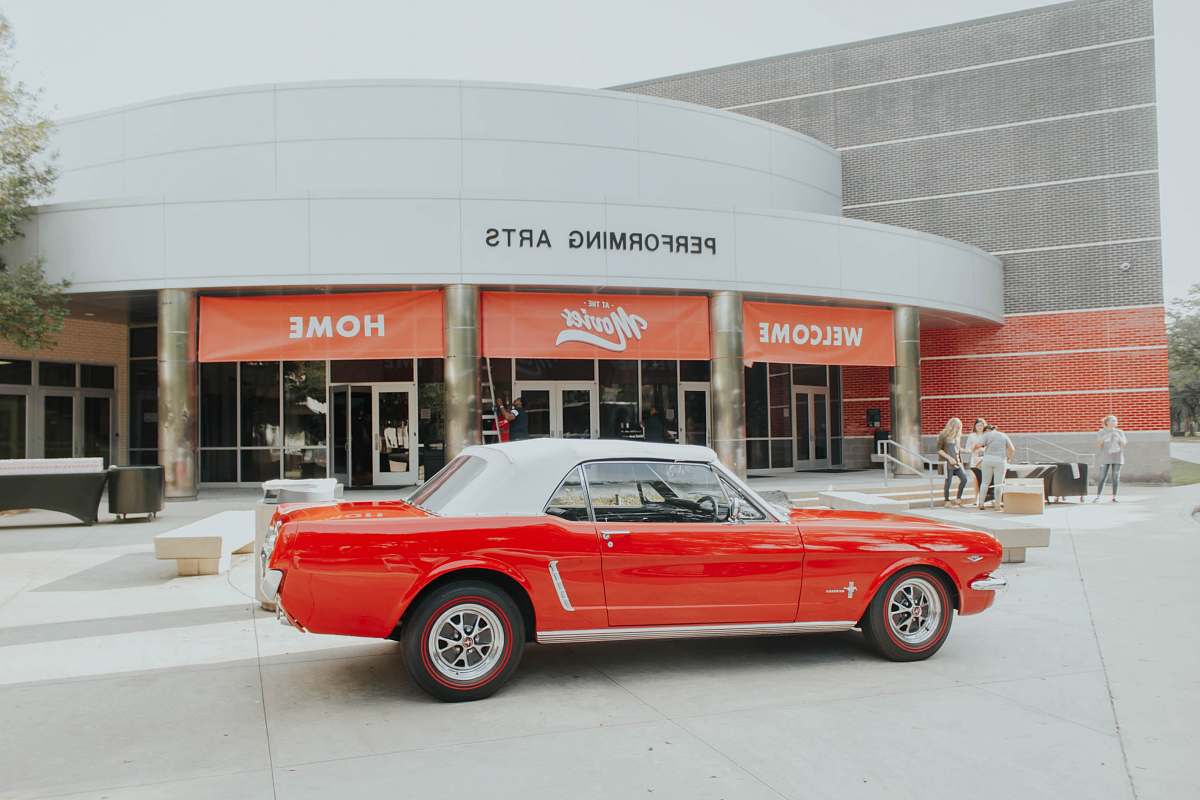 automobile parked red and white coupe red