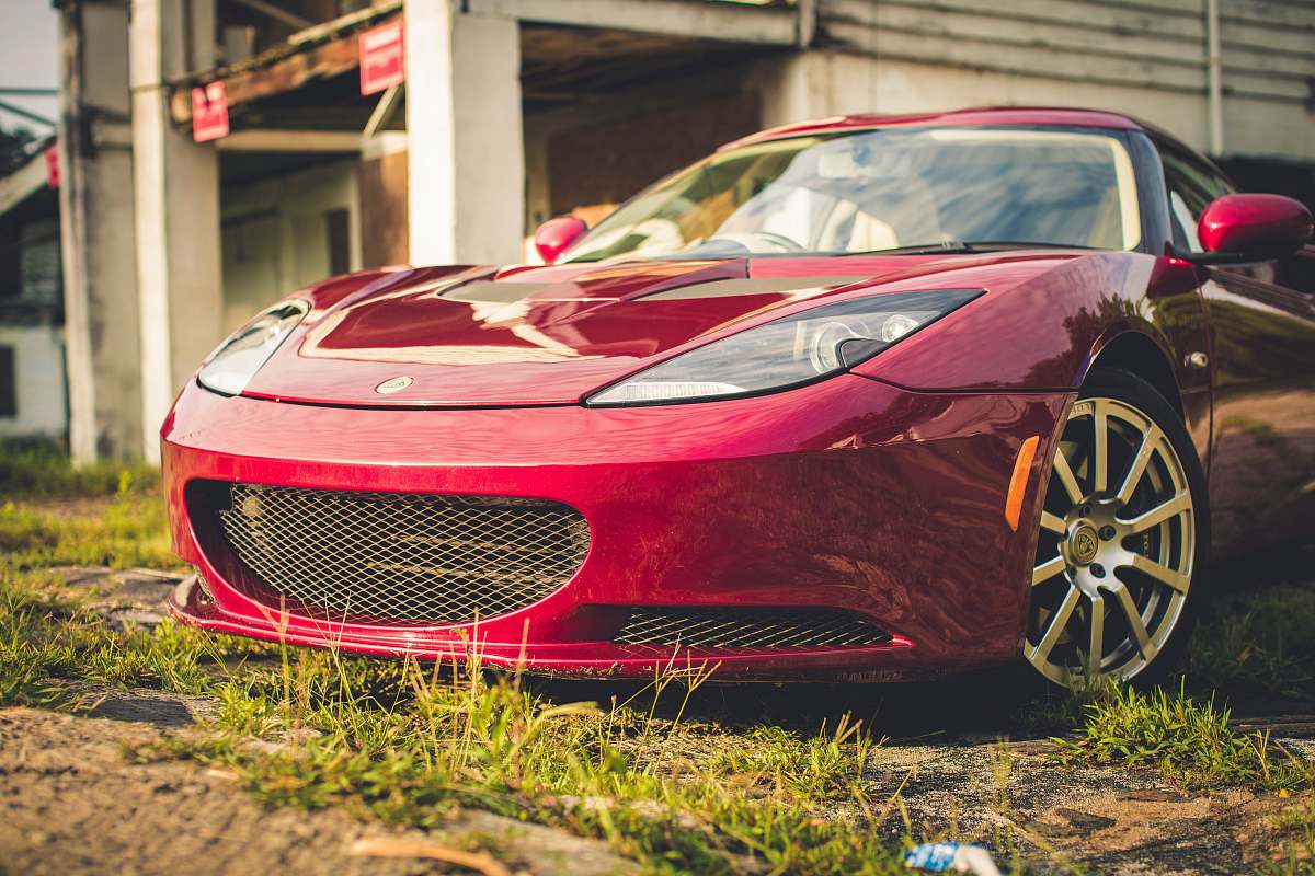 automobile red luxury car parked vehicle
