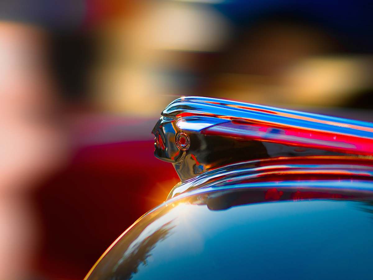 shiny selective photography of glass container hood ornament