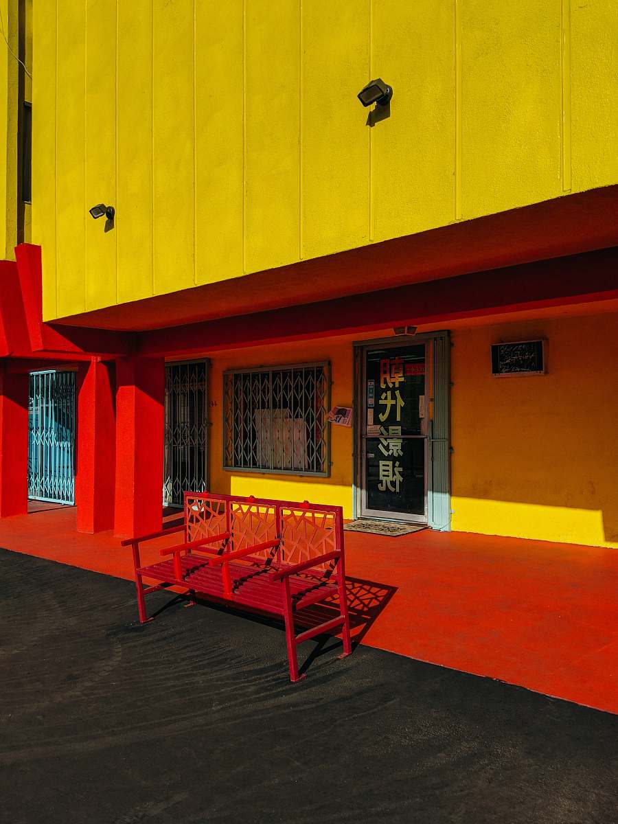 furniture red bench in front of store facade chinatown