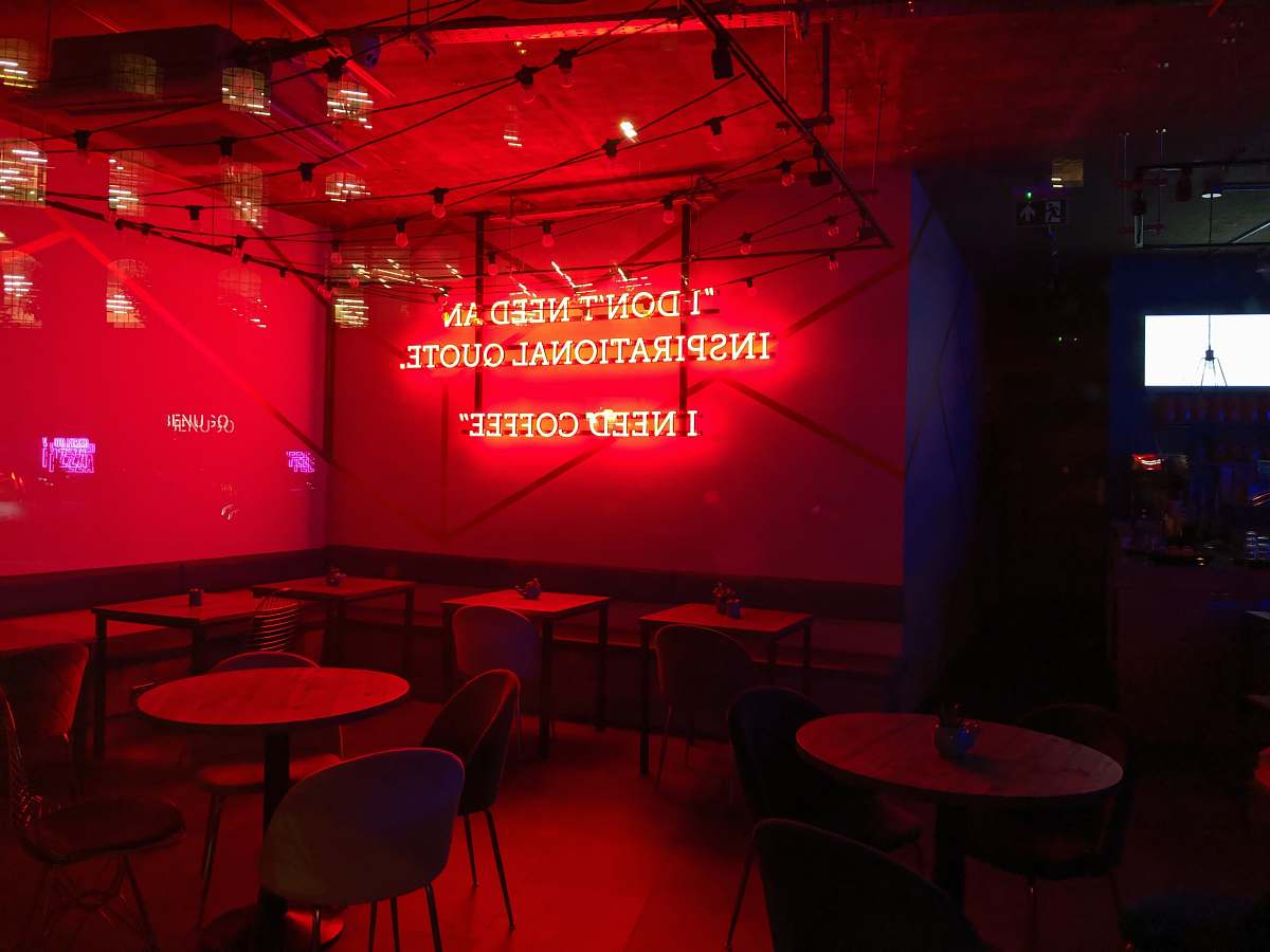 furniture shallow focus photo of red neon signage restaurant