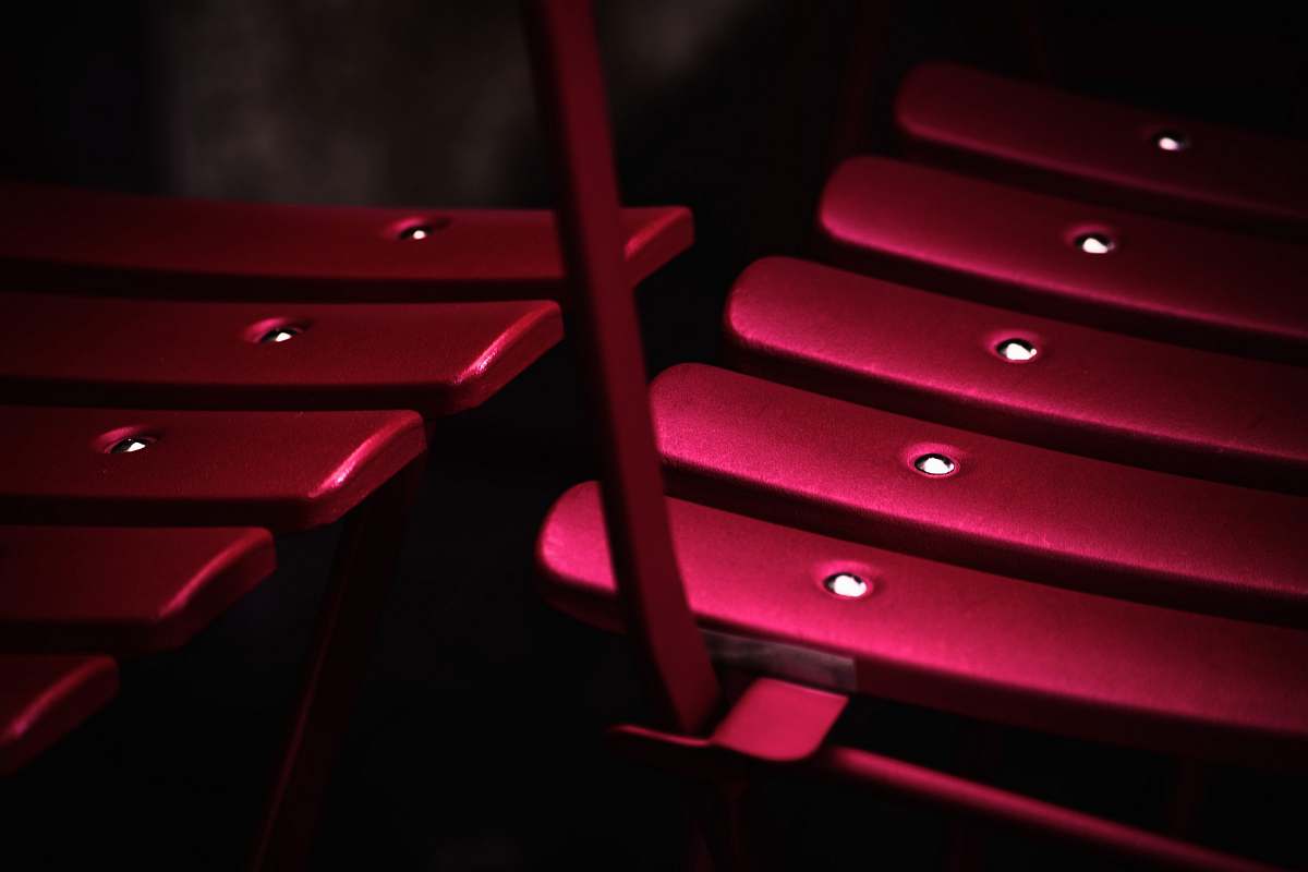 italy shallow focus photography of pink metal chair furniture