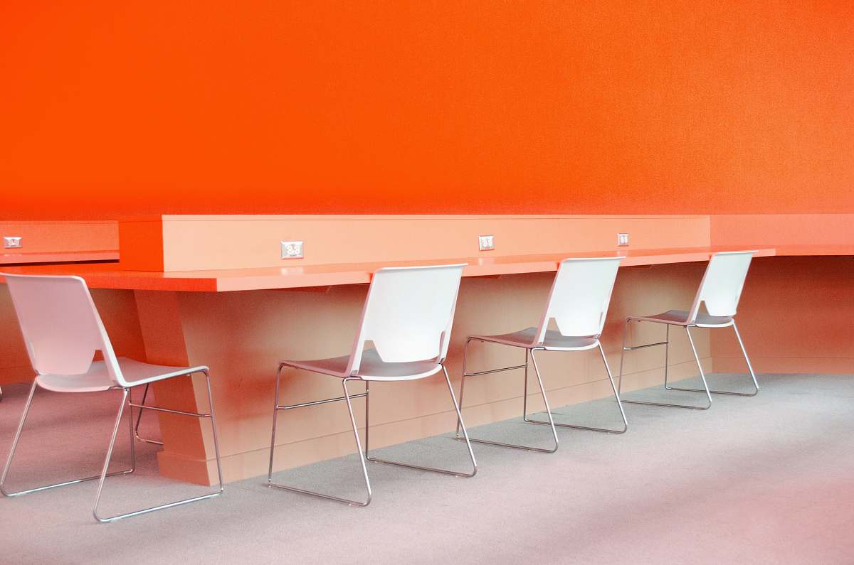 furniture white plastic chairs under desk table