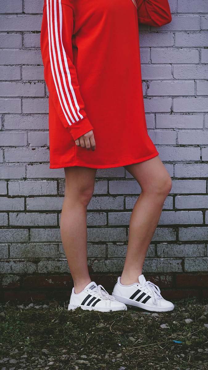 apparel woman wearing red sweater dress footwear