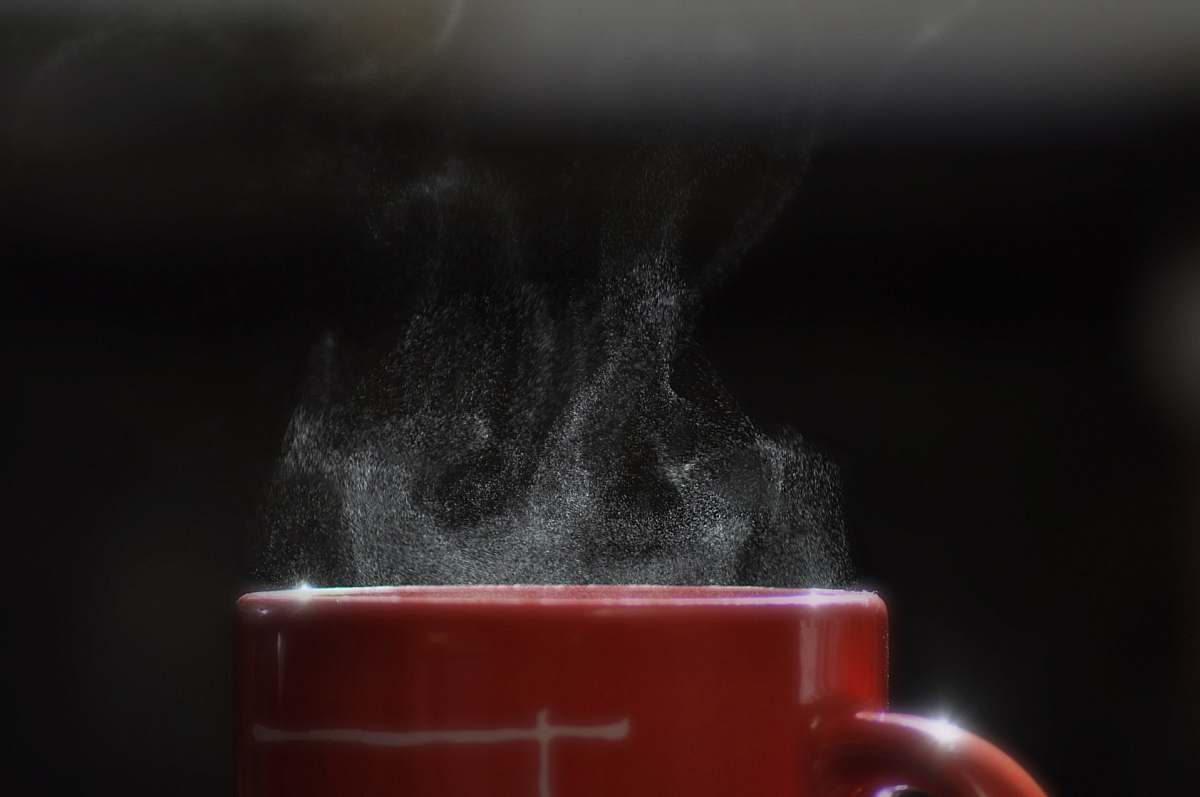 cup smoke coming out from mug filled with beverage coffee cup