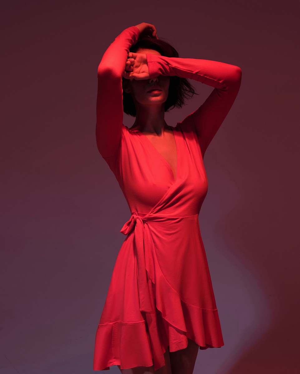 apparel woman wearing pink long-sleeved dress covering her face clothing