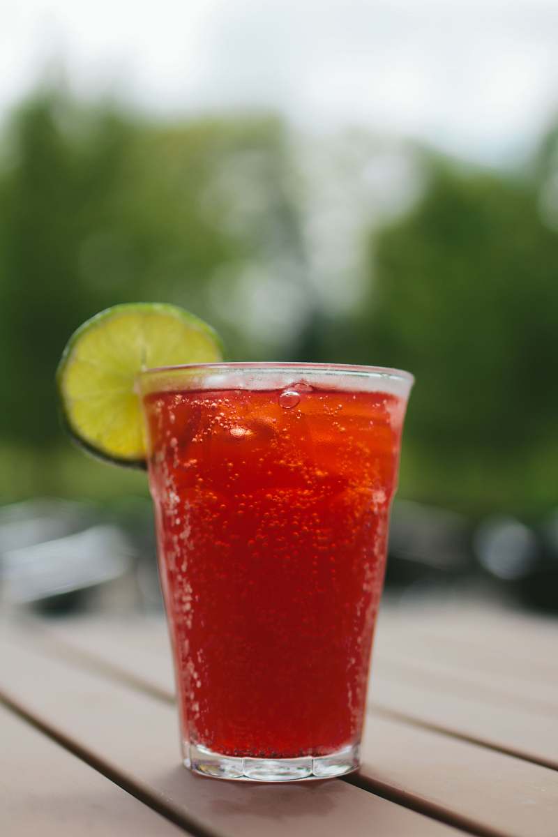 beverage clear drinking glass fiild with red liquid alcohol