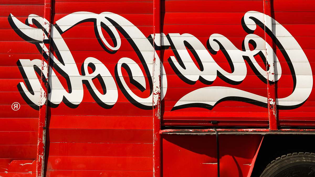 coke close-up photography of red and white Coca-Cola trailer beverage