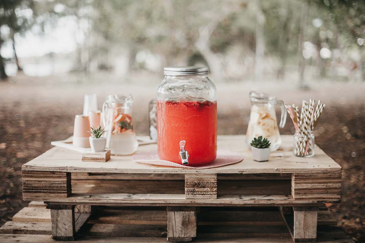juice red juice in clear glass jar beverage