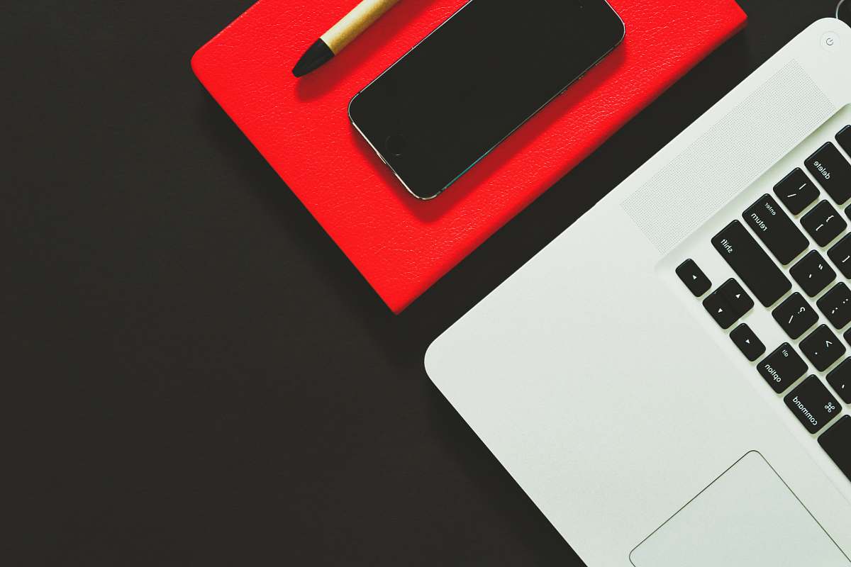 keyboard laptop beside smartphone computer keyboard