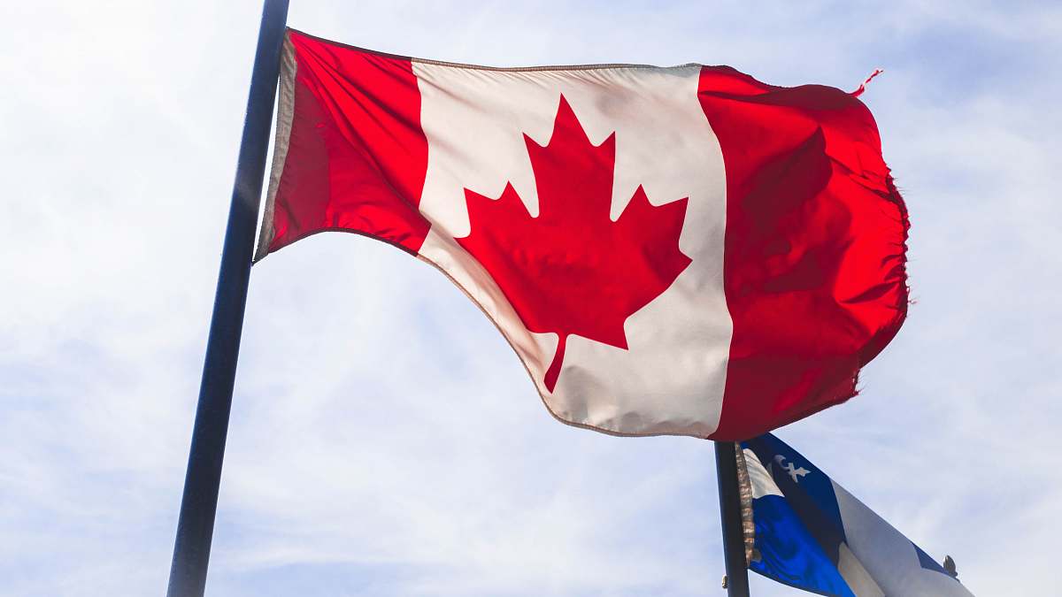 emblem Canada flag waving during daytime canada