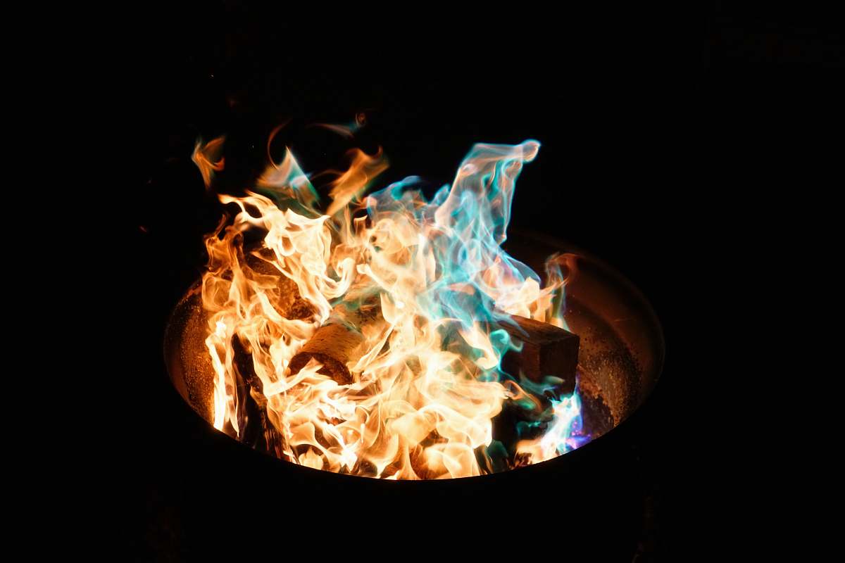 blue fire burning in barrel flames