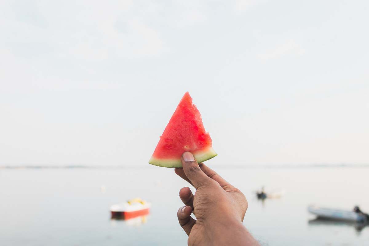 watermelon person holding sliced watermelon flora