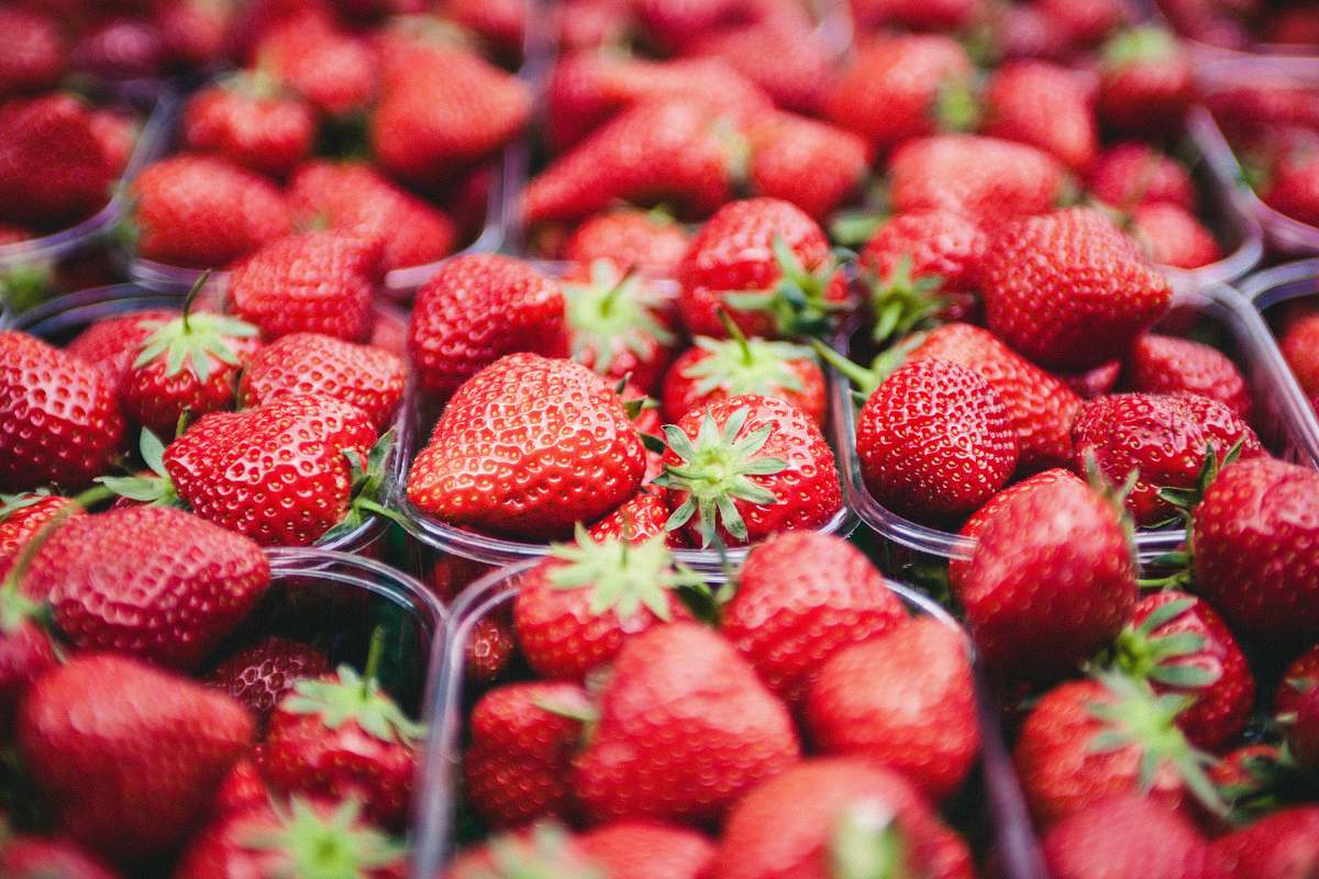 food selective focus photo of strawberries in clear plastic containers strawberry