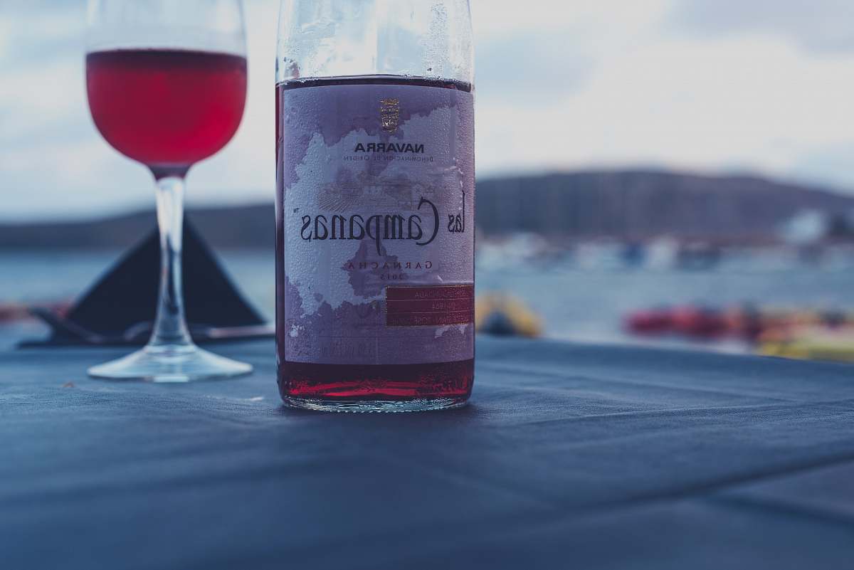 beverage Campanas red wine bottle beside wine glass drink