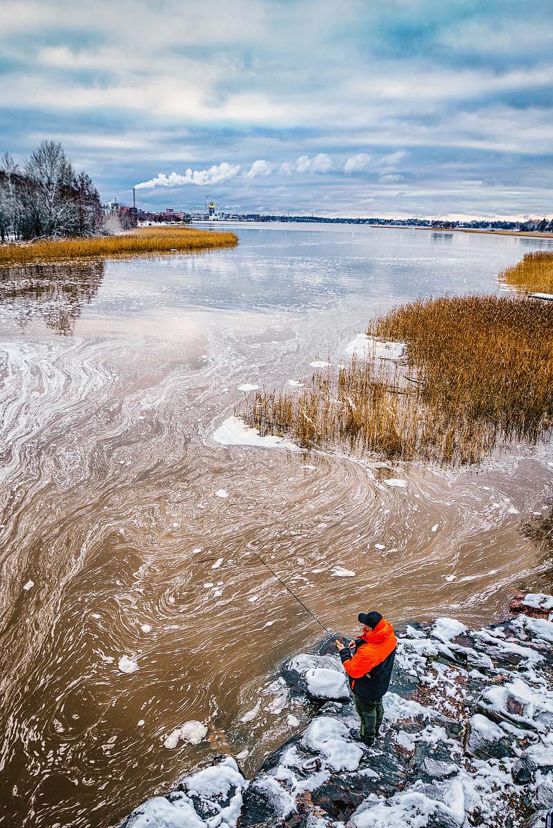 person aerial photo of man fishing on body of water people