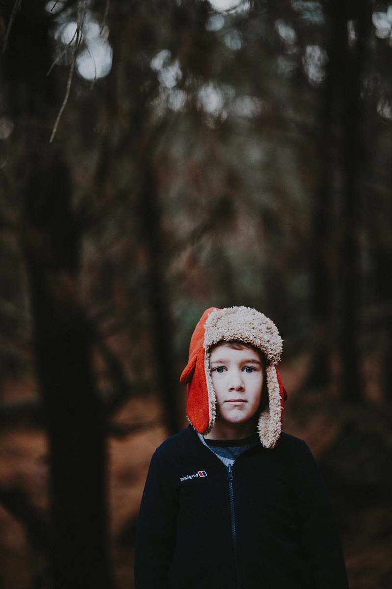 people boy wearing red ear pluff person