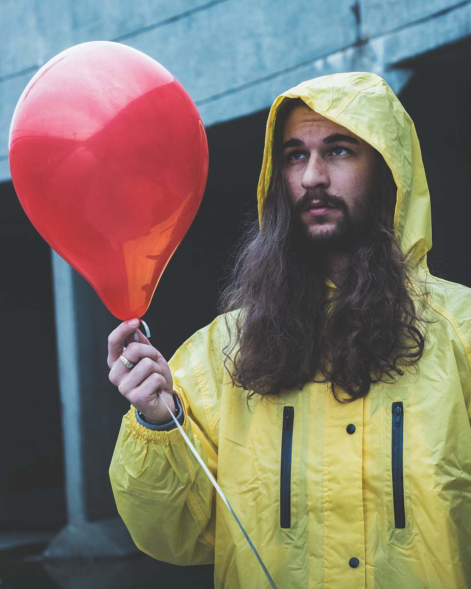 people man holding red balloon person