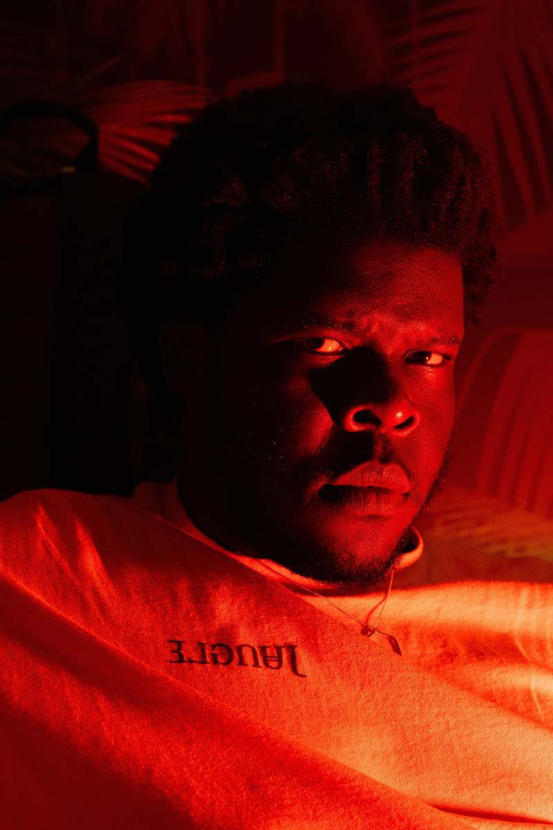 person man lying on bed hair