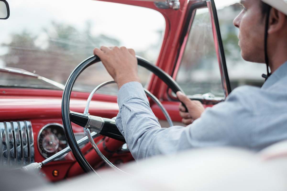 person man ride on red vehicle vehicle