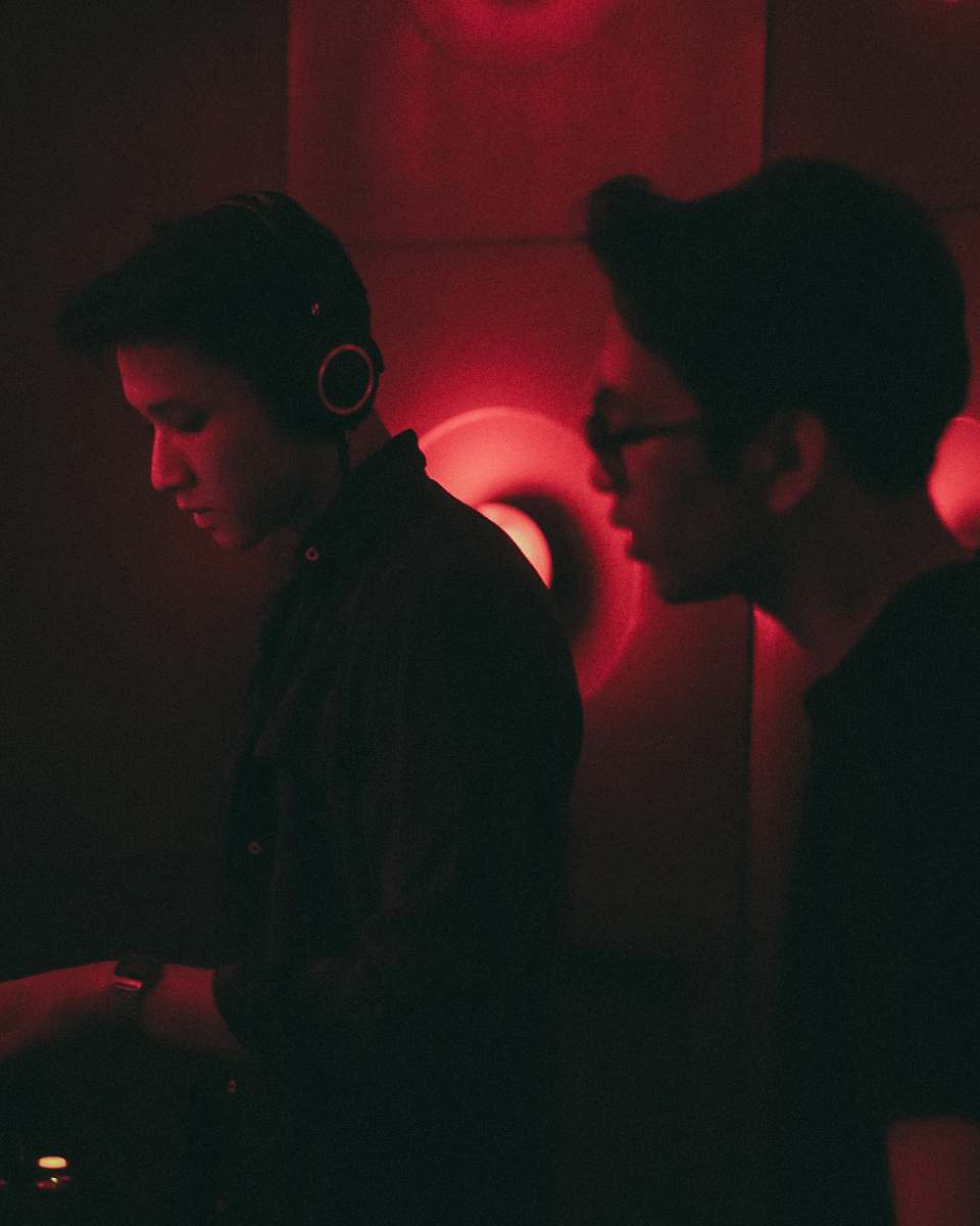 person man wearing black dress shirt using black headphones the foundry