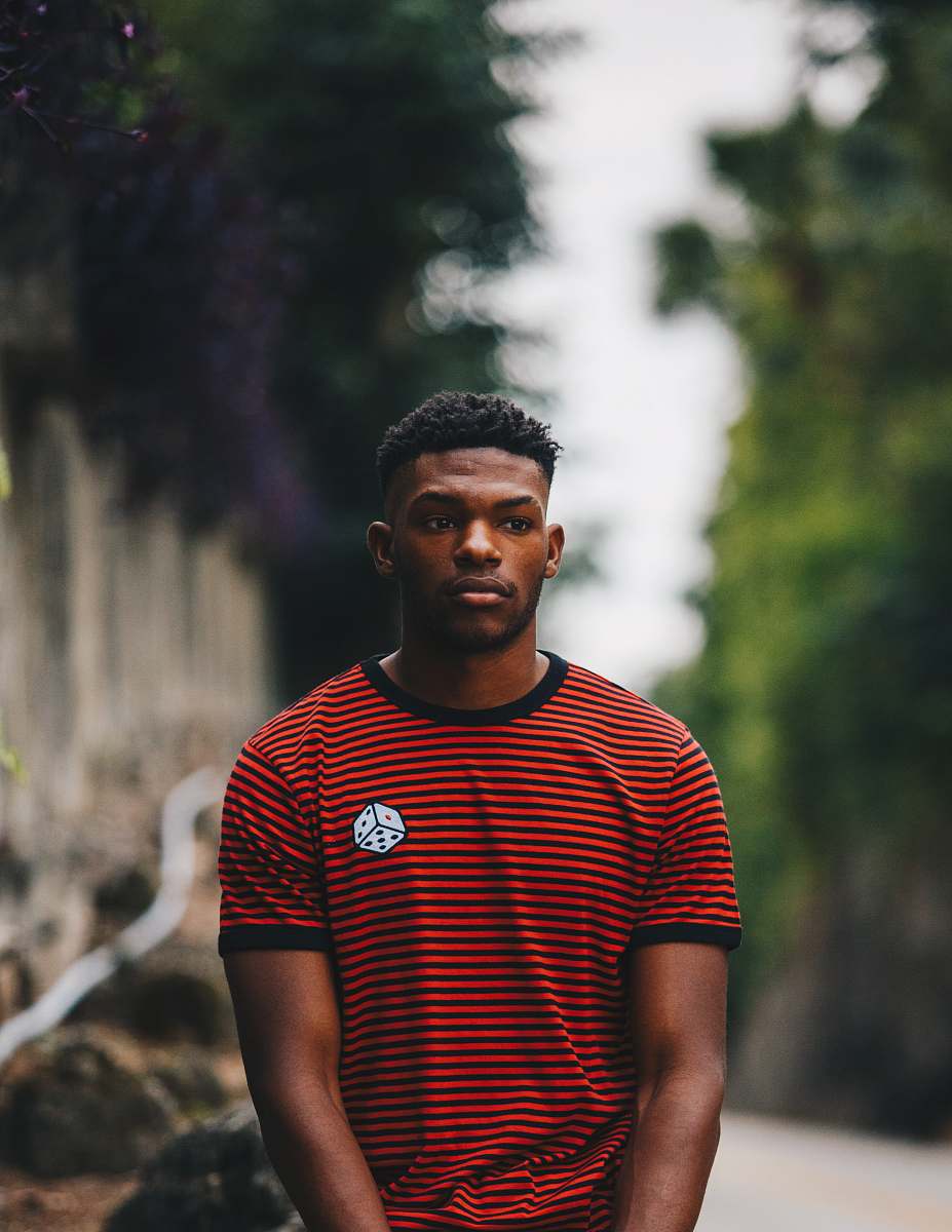 people man wearing red and black striped ringer shirt person