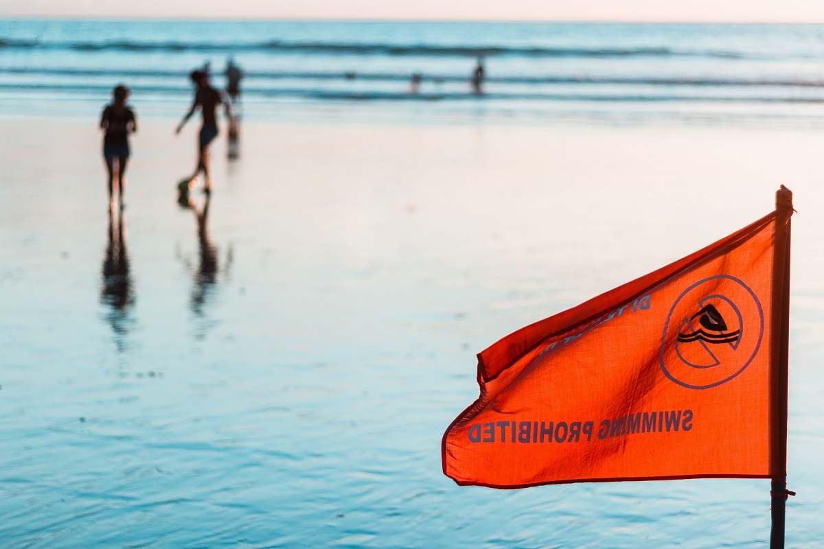 person orange flag flag