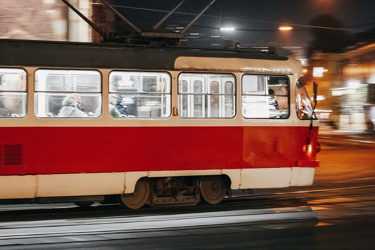 person people inside white and red bus during night time train