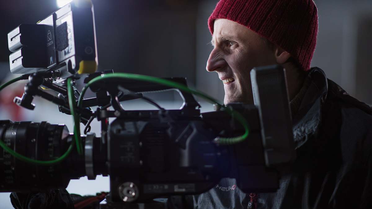 person person facing black and gray professional camera people