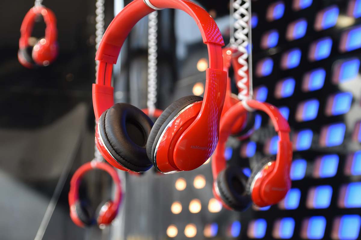 person red and black headphone people