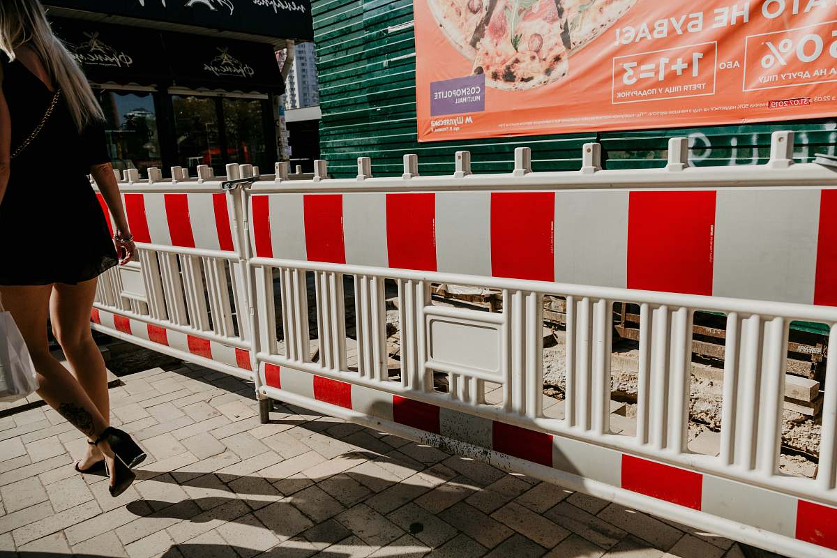 person red and white metal fence fence