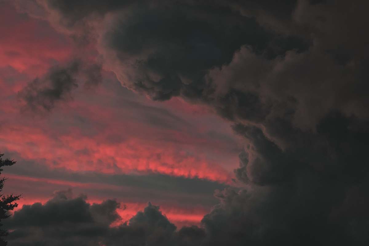 person time-lapse photography of gray clouds sky