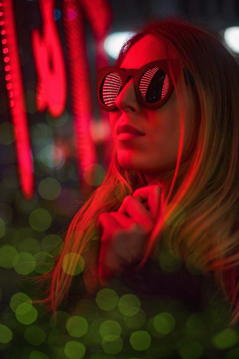 person woman looking at LED signage people