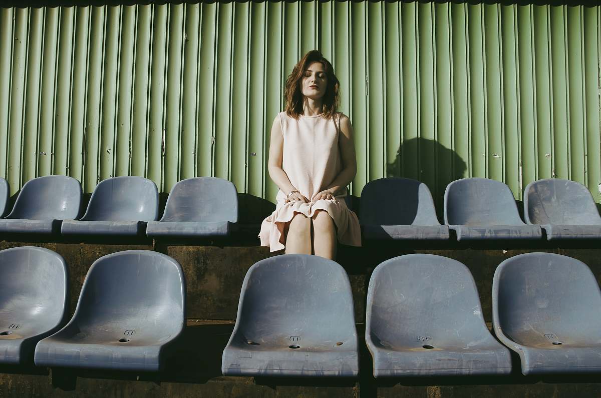 furniture woman sitting on gang chair chair