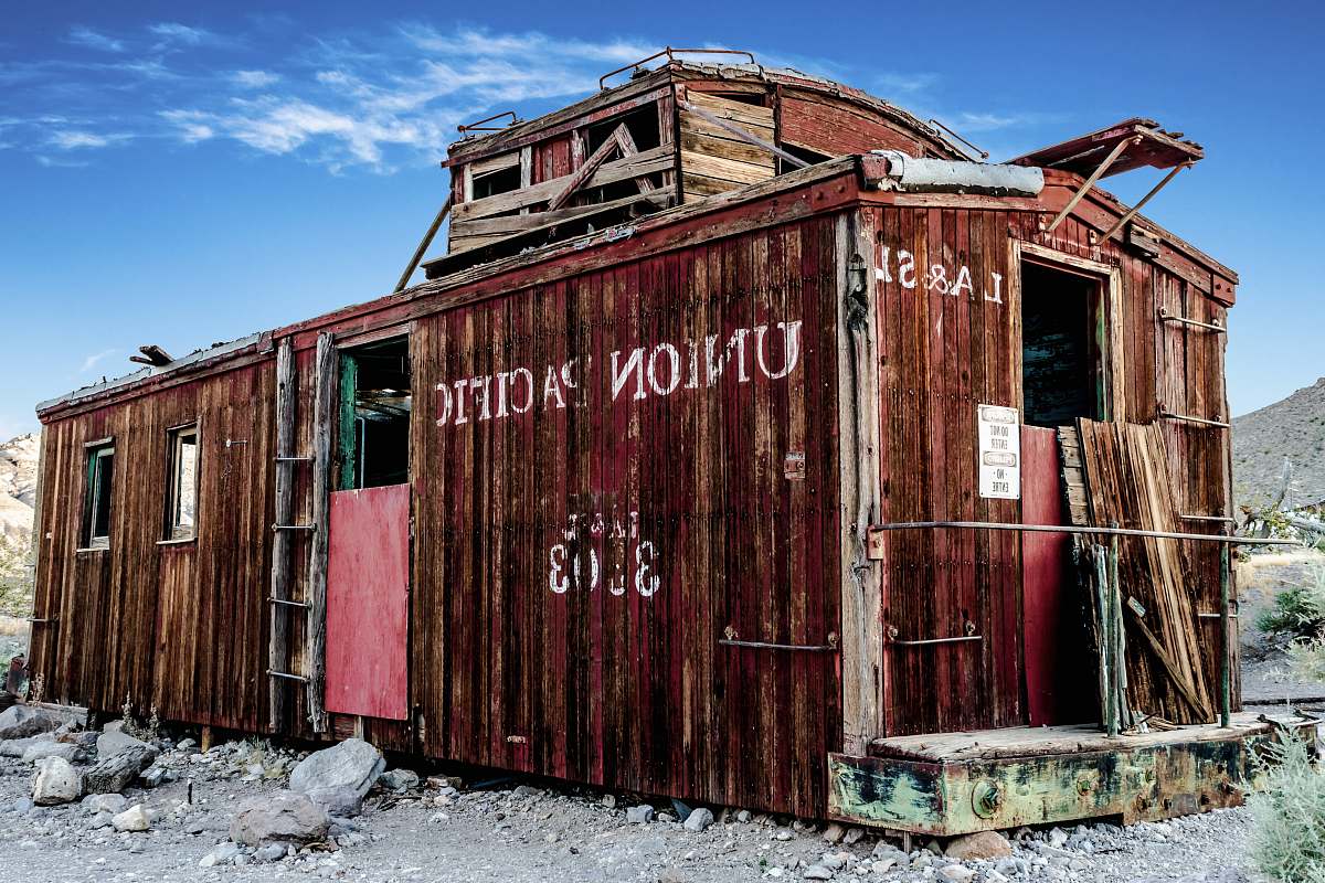 railroad brown containerized housing unit train