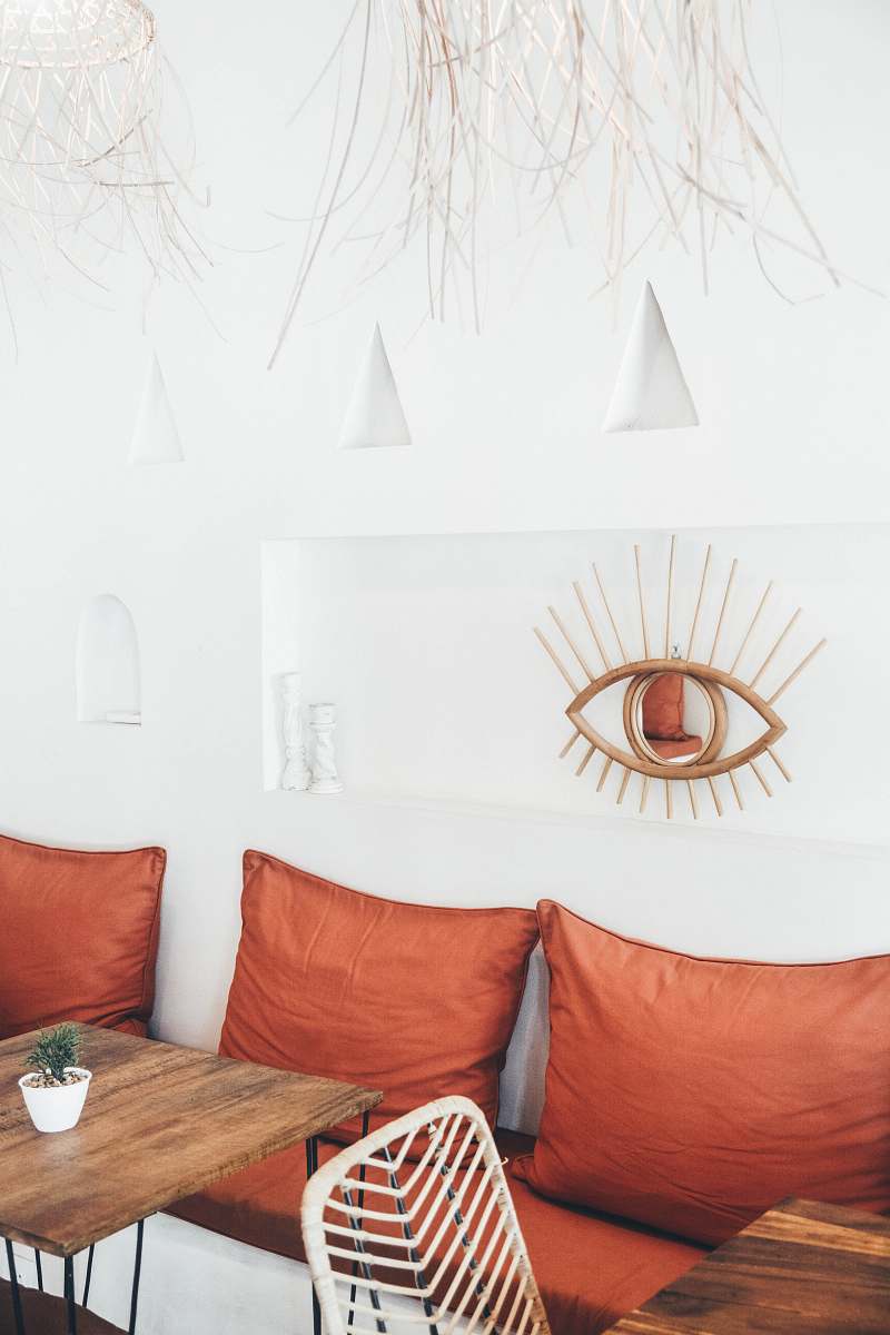 room three red throw pillows behind tables canggu