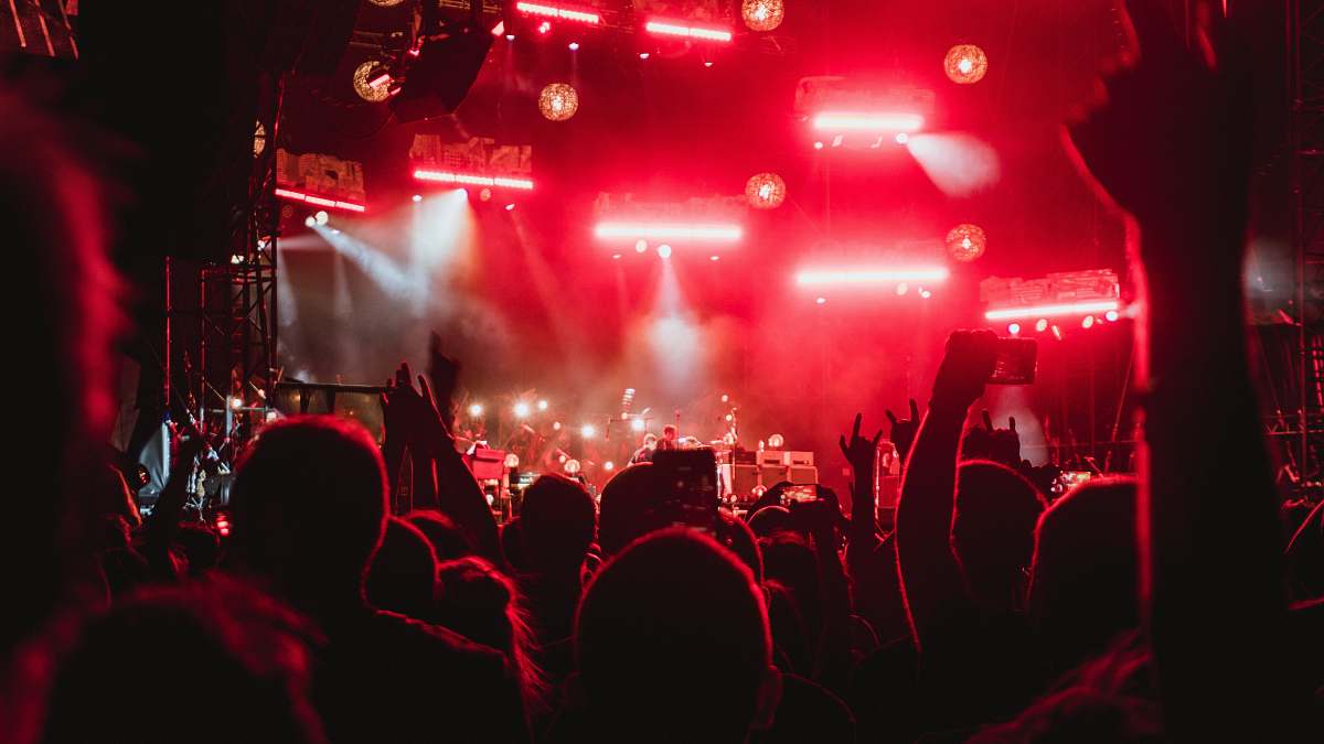 concert photo of people inside concert venue crowd