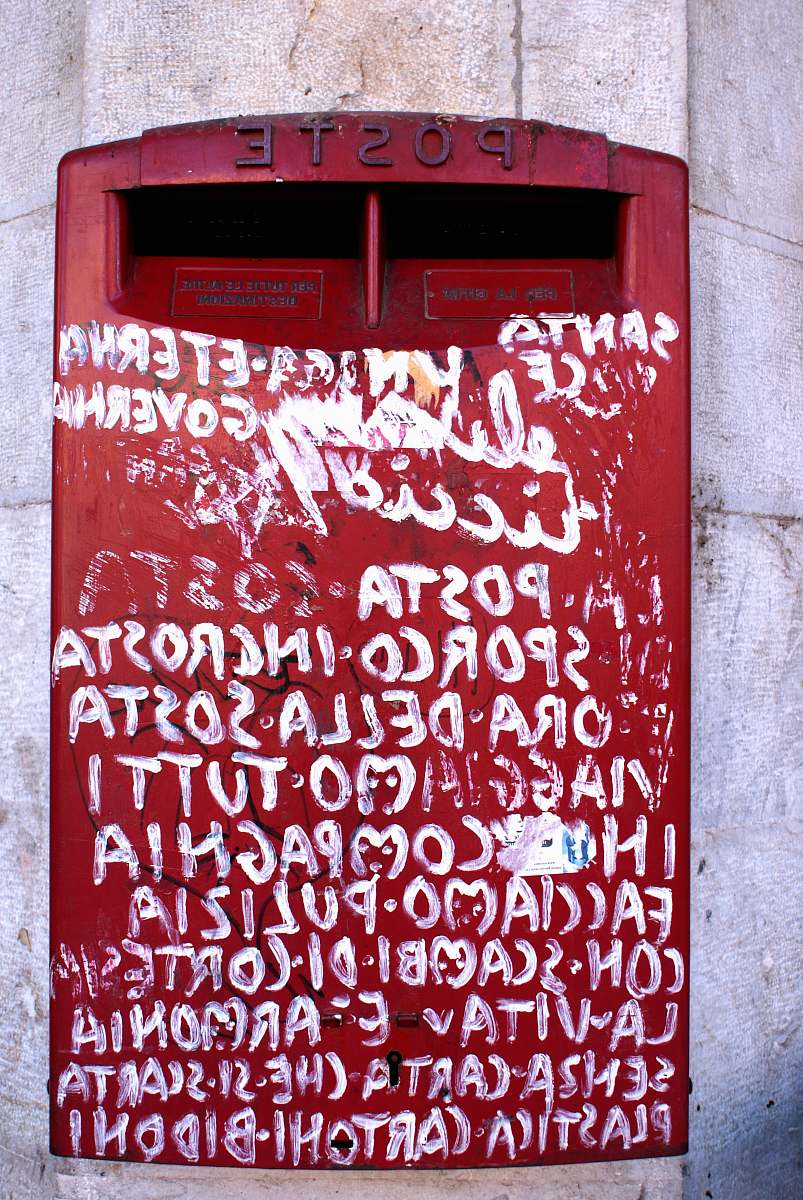 graffiti red mail box with white print red