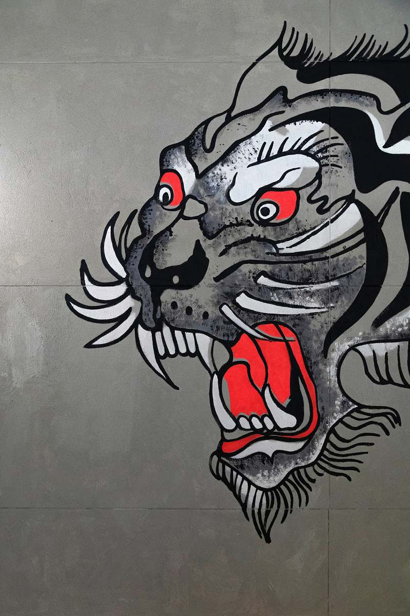 text gray, black, and white tiger art on wall graffiti
