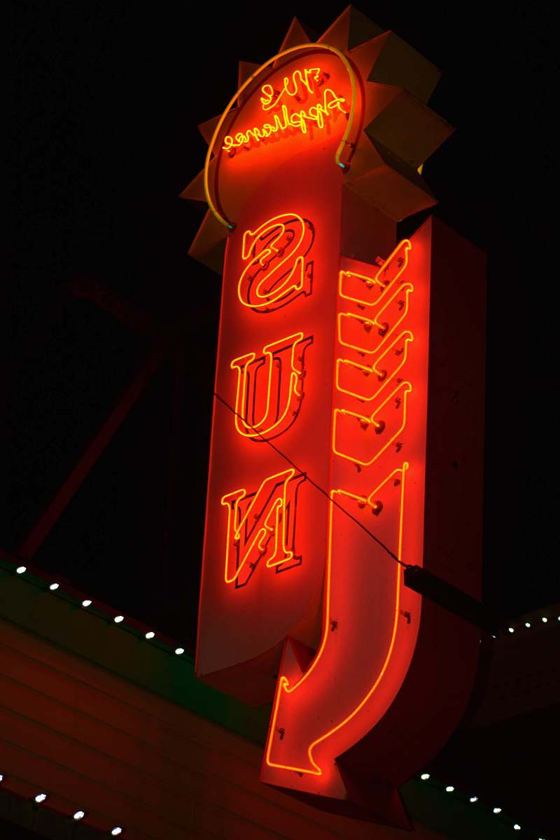 neon red sun signage six flags new england