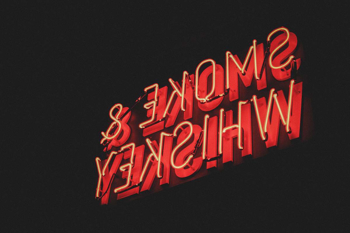 neon yellow and red Smoke & Whiskey LED signage dynamite