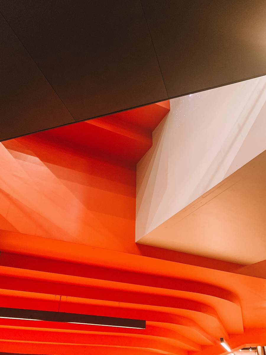 banister orange and white painted building interior handrail